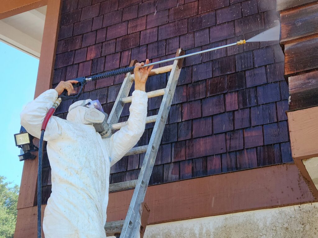 Pressure/power washing a house with wood siding