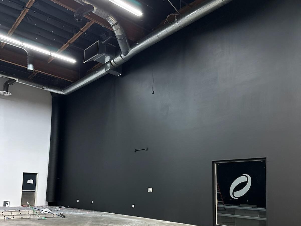 Interior production studio freshly painted with black and white walls for commercial services
